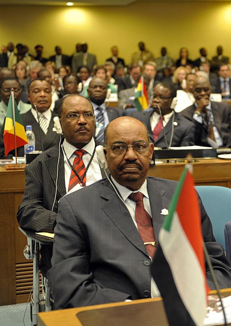 Sudanese President Omar al-Beshir attends on January 31, 2010, the opening of the three-day AU summit in Addis Ababa. Al-Beshir could face charges of genocide at the International Criminal for war crimes in Darfur. If the charges go through, they will be  (Simon Maina/AFP/Getty Images)