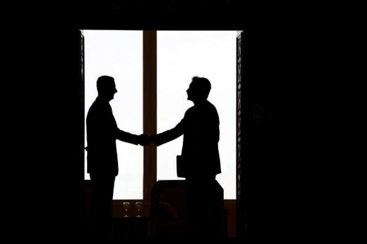 Syrian President Bashar al-Assad (L) shakes hands with U.S. under secretary for political affairs William Burns (R) ahead of their meeting in Damascus on February 17, 2010.  (Louais Beshara/AFP/Getty Images)