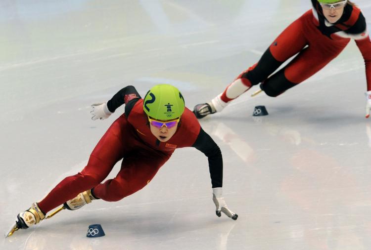 OLYMPIC RECORD: China's Wang Meng and Canada's Jessica Gregg (R) compete in the Ladies' Short Track Speedskating 500m quarterfinals at the Pacific Coliseum. Wang went on to win gold.  (Saeed Khan/AFP/Getty Images)