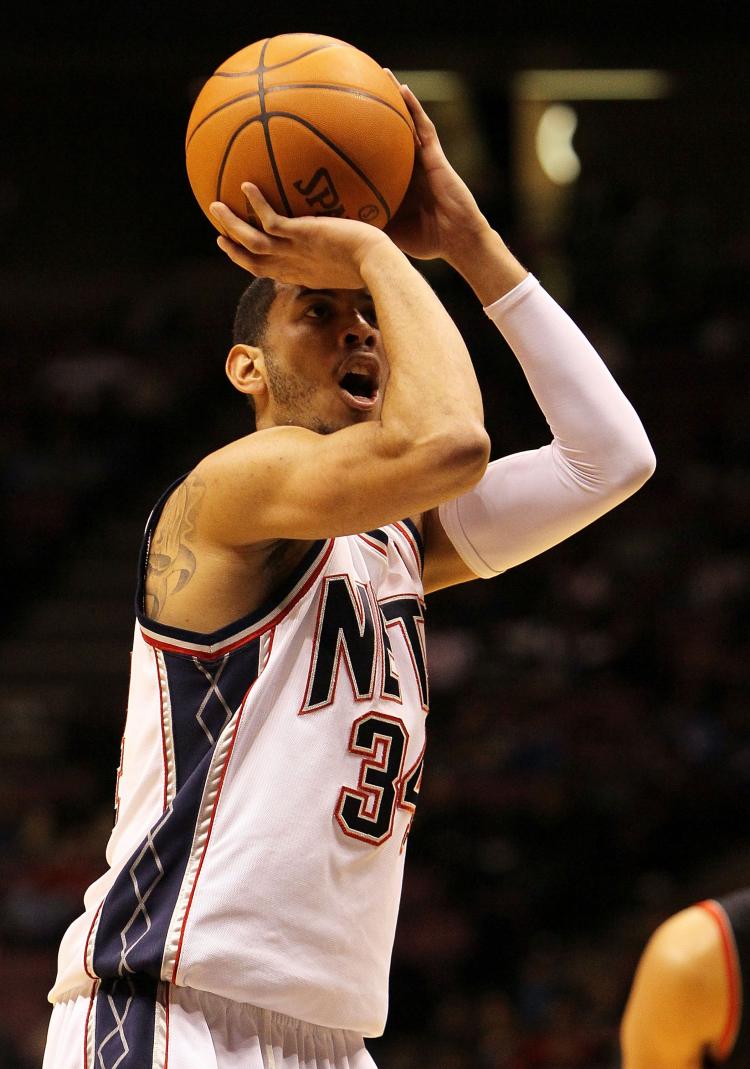 Devin Harris had a solid game with 19 points but the New Jersey Nets fell short to the Charlotte Bobcats on Wednesday. ( Jim McIsaac/Getty Images )