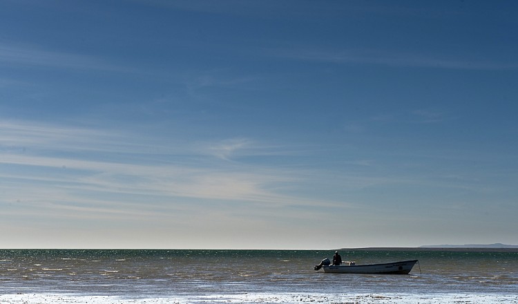 A fisherman in his boat seen here in the Pacific Ocean