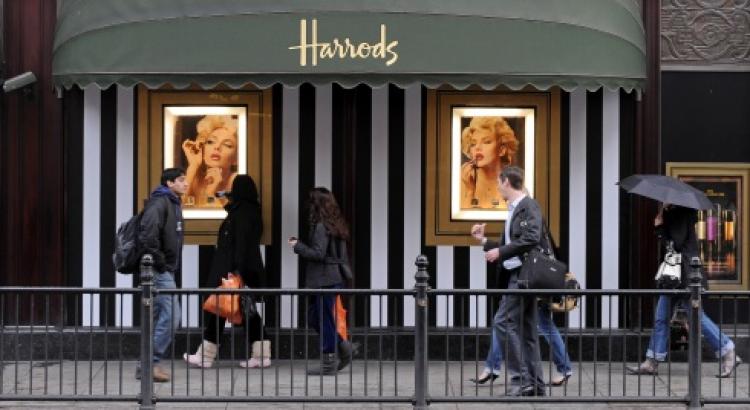 ROBUST SALES: Shoppers walk past Harrods department store in London, on March 12. (Ben Stansall/AFP/Getty Images)
