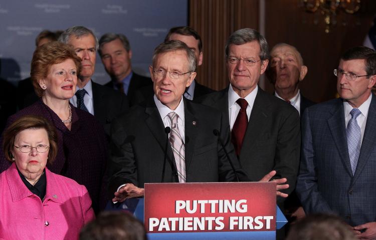 Flanked by Senate Democrats, Senate Majority Leader Harry Reid (D-NV) (C) speaks after a vote on health care on Capitol Hill on Mar. 25, 2010 in Washington, DC.  (Mark Wilson/Getty Images)