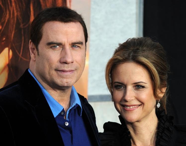 Actor John Travolta and his wife actress Kelly Preston arrive for the premiere of 'The last song' in Hollywood, California on March 25.  (Gabiel bouys/Getty Images)