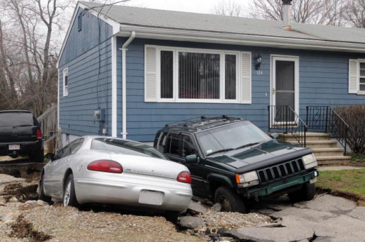 Cars are sunk into a driveway at a home on South Main Street Mar. 31, 2010 in Freetown, Massachusetts. (Darren McCollester/Getty Images)