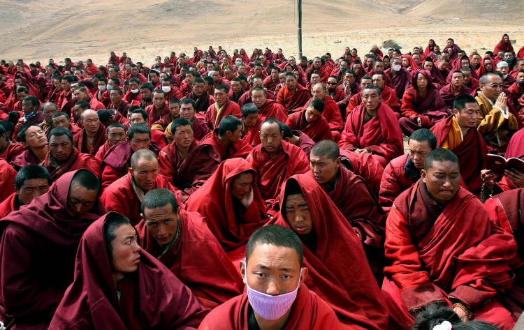 Tibetan monks gather outside their destroyed monastery in Jiegu, Yushu county, in China's northwestern province of Qinghai on April 20. (AFP/Getty Images)