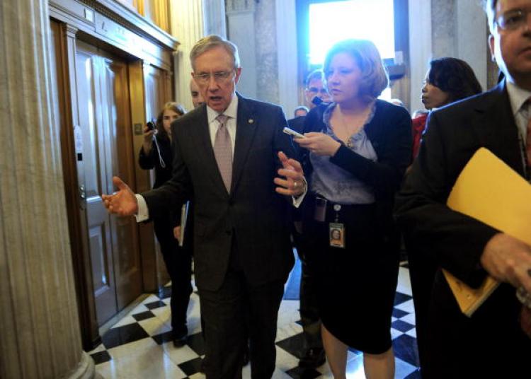 US Senate Majority Leader Harry Reid talks with reporters while walking to the Senate Chamber on April 28, 2010 inside the US Capitol in Washington, DC. (Tim Sloan/Getty Images)