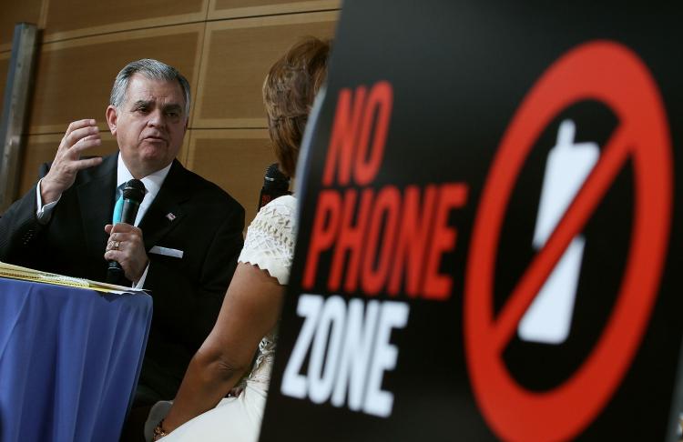 Transportation Secretary Ray LaHood appears with talk show host Gayle King at the Newseum on April 30, in Washington, DC. The Oprah Winfrey Show is sponsoring a 'No Phone Zone' rally nationwide. (Mark Wilson/Getty Images)