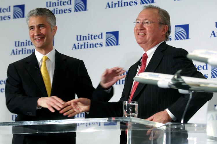 APPROVED: Glenn Tilton (R), chairman, president and CEO of United Airlines, and Jeff Smisek, CEO of Continental Airlines, smile after shaking hands during a press conference on May 3, 2010 in New York City announcing the company's merger plans. (Hiroko Masuike/Getty Images )