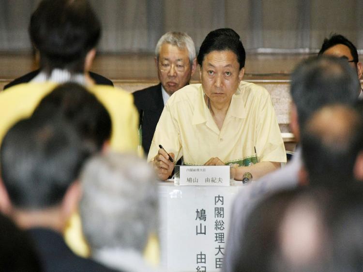 Japanese Prime Minister Yukio Hatoyama listens to local residents who live beside the U.S. Marine Corps Air Station Futenma during their dialogue meeting in Ginowan, Okinawa Prefecture, on May 4. Hatoyama abandoned a plan to move the unpopular U.S. airbase entirely off Okinawa Island, backtracking on a key election pledge after months of dithering that angered Washington. (JIJI PRESS/AFP/Getty Images)
