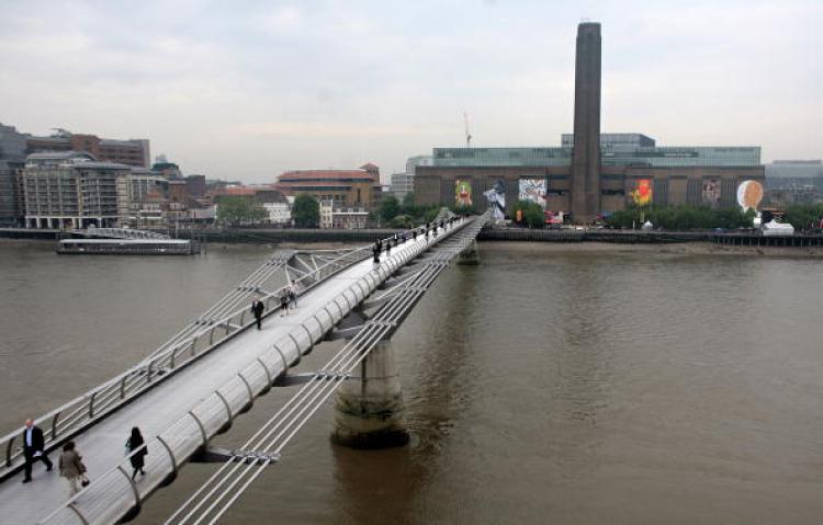 The Chancellorâ��s Spending Review keeps free entry to Tate Modern, seen here behind the Millenium Bridge on the bank of the Thames in London, 23 May 2008. Tate Modern will also have cash for its Â£215 million extension. The gallery celebrated its tenth anniversary on May 10, 2010. (Shaun Curry/AFP/Getty Images)