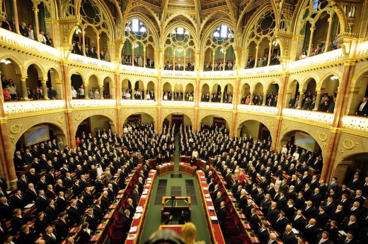 Representatives of the Hungarian Parliament sing the national anthem on May 14, during the re-formation of Hungarian Parliament. A Hungarian nationality law passed on May 26 grants any ethic Hungarian living in any country citizenship.  (Attila Kisbenedek/Getty Images)