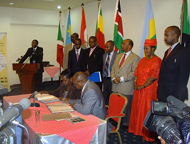 WATER SUPPLY: Uganda's Minister for Water and Environment Maria Mutagamba (L) and Uganda's Deputy Foreign Minister Isaac Musumba, sign the Nile Basin Cooperative Framework in Entebbe, on May 14. (Ben Simon/AFP/Getty Images)