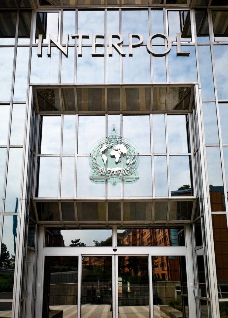 The entrance of the world's largest international police organization, Interpol headquarters in Lyon, France. Suspects can be arrested based on an Interpol red notice-a valid request by a member country for the arrest and extradition of a crime suspect. (Jean-Philippe Ksiazek/AFP/Getty Images)