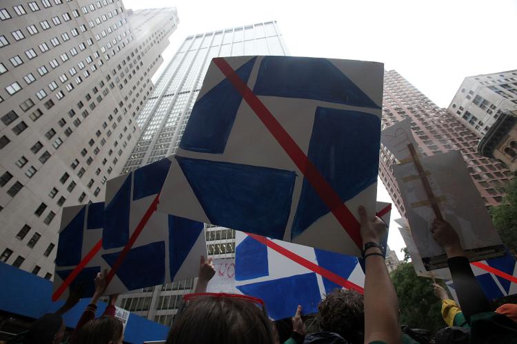 Protesters demonstrate outside JPMorgan Chase's annual shareholder meeting in downtown Manhattan last May in NYC. Last Week Hempstead Village on Long Island became the first New York local government to close its $12.5 million bank account with JPMorgan Chase Bank over the bank's lending and foreclosure policies. (Mario Tama/Getty Images)