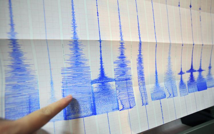 A man points at a seismic chart at the Central Weather Bureau in Taipei on March 4, 2010 after a 6.4 magnitude rocked southern Taiwan near the island's second largest city of Kaohsiung. The quake hit about 70 kilometres (about 40 miles) from the main south. (Sam Yeh/AFP/Getty Images)