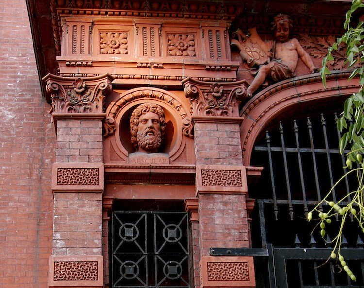 A detail of the facade of the Stuyvesant Polyclinic at 137 Second Avenue shows a bust of Asclepius, the Greek god of medicine.  (Tim McDevitt/The Epoch Times)