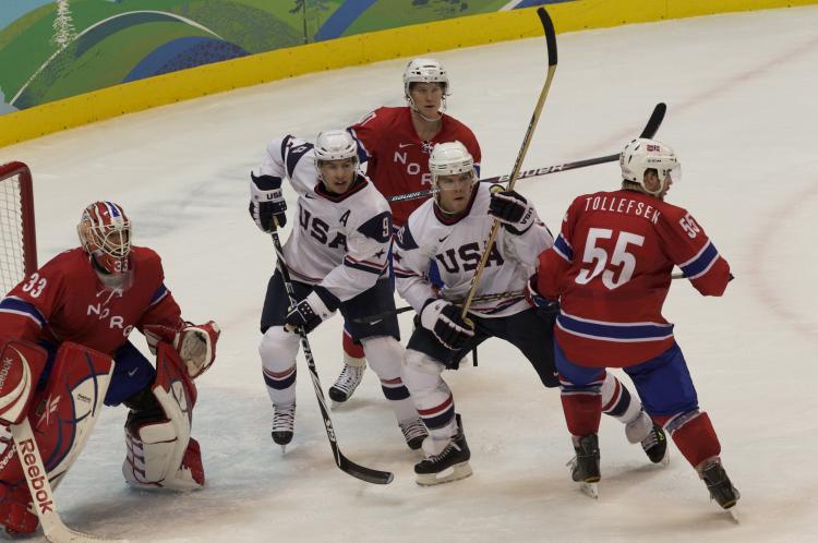 Zach Parise (9) and Paul Stastny (26) put the heat on Norway goalie Pal Grotnes on Thursday. (Evan Ning/Epoch Times Staff )