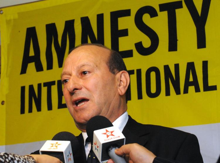 Mohamed Sektaoui, head of Amnesty International's Moroccan branch presents their annual report in Rabat on June 8. Amnesty International published a report detailing continued human rights abuses in Libya, despite the country's greater international role. (Abdelhak Senna/Getty Iamges)