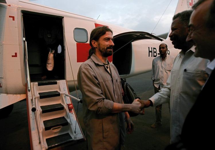One of the two German aid workers who was kidnapped on June 22nd when gunmen swooped on their offices in Sudan's war-torn Darfur region, is greeted at Khartoum airport after being freed earlier on July 27. (Ashraf Shazly/Getty Images)