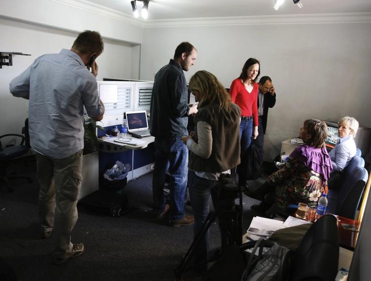 Al-Jazeera journalists gather at the pan-Arab television channel's bureau in Cairo on January 30, after Egypt ordered a shutdown of Al-Jazeera's operations. (Mohammed Abed/AFP/Getty Images)