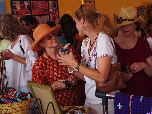 The Beads of Esiteti booth teams with shoppers who love the beads and support the cause at the July art market in Sante Fe. (Courtesy of ASK)