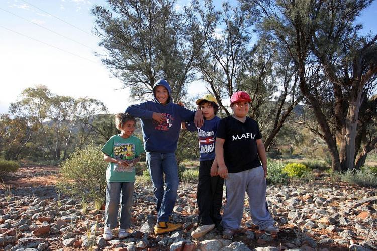 TOUGH ODDS: File photo of Indigenous children of the Iga Warta community in the South Australian Outback. According to Australian statistics, only one of these four boys will survive to the age of 65. By all development indicators, indigenous Australians are one of the poorest communities in the world. (Lisa Maree Williams/Getty Images)