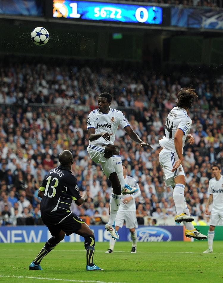 HOT HEADER: Emmanuel Adebayor (R) of Real Madrid scores his second goal past William Gallas (L) of Tottenham Hotspur during the UEFA Champions League quarter final first leg match between Real Madrid and Tottenham Hotspur. (Jasper Juinen/Getty Images)