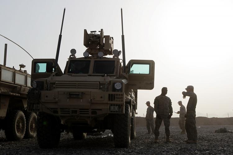 DAWN PATROL: U.S. Army soldiers with Task Force Thor Route Clearance Patrol from 23rd Engineering Company, Airborne prepare for a day-long mission to clear IEDs (Improvised Explosive Devices) Wednesday in Jeluwar, Afghanistan. (Justin Sullivan/Getty Images)