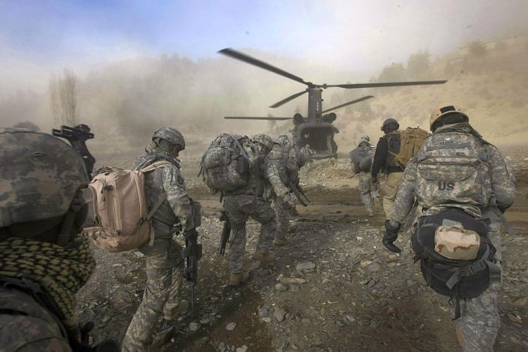 PATROL: U.S. Army soldiers from 2-506 Infantry 101st Airborne Division and Afghan National Policemen and Army load onto a UH-47 Chinook helicopter during day three of Operation Shir Pacha along the Afghan-Pakistan Border, in this file phot from 2008. (David Furst/AFP/Getty Images)