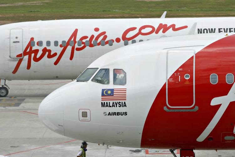 Air Asia has offered free airfare tickets to Thailand, in the latest bid to boost tourism in the country that has been paralyzed by bloody political clashes during the last two months. (Tengku Bahar/Getty Images)