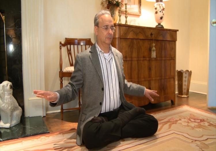 Alan Adler is practicing the sitting meditation. (The Epoch Times)