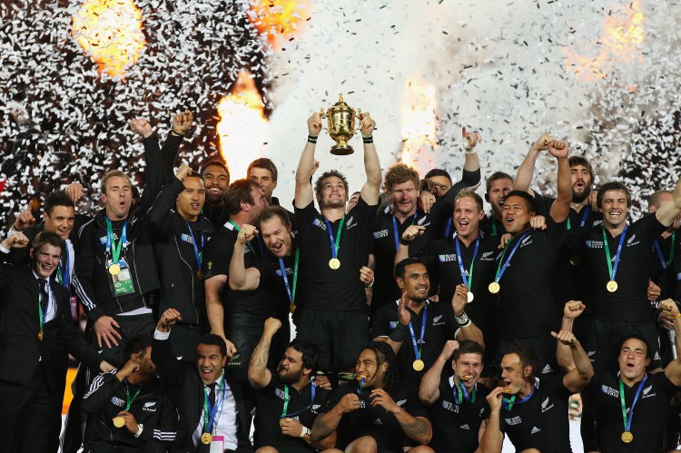 Captain Richie McCaw of the Rugby World Cup Champion All Blacks hoists the Webb Ellis Cup after beating France 8-7 in the final on Sunday night. This was the first championship for the All Blacks since 1987. (Cameron Spencer/Getty Images)
