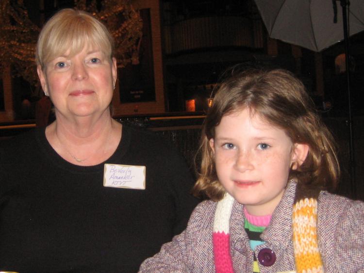 Ms. Amacker, account executive for CBS, with her granddaughter. (The Epoch Times)