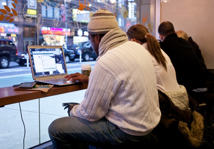 people use their laptops at a starbuck in New York City in this file photo. 