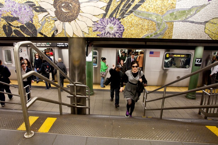 Subway riders exit the 6 train at the 77 Street station on the Upper East Side, New York, in this file photo.