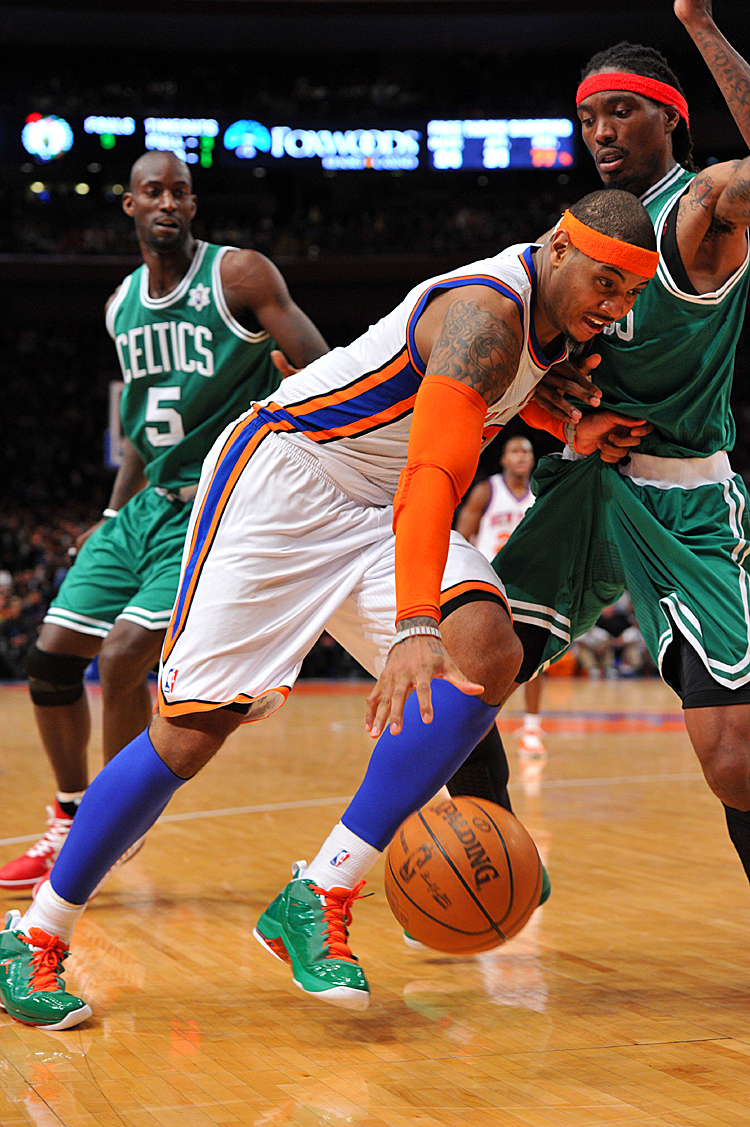 Carmelo Anthony (C) led the Knicks past Kevin Garnett's (5) Celtics with 37 points, many off one-on-one plays. (Christopher Pasatieri/Getty Images)