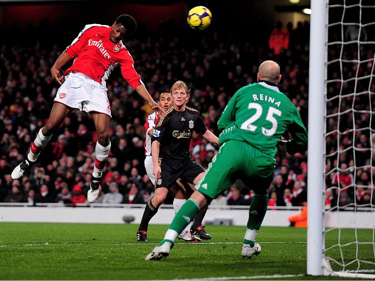 GUNNERS DOWN REDS: Arsenal's Abou Diaby heads in the winner against Liverpool on Wednesday. (Mike Hewitt/Getty Images)