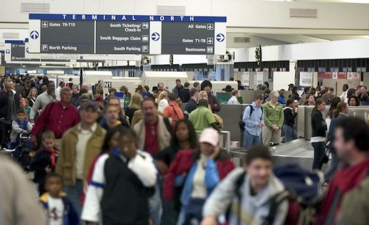 Travelers work their way through Atlanta's Hartsfield-Jackson International Airport in GA, where Louis Lu Yu had been deported by federal authorities on a plane bound for Seoul with a connection to Shanghai.  (Barry Williams/Getty Images)