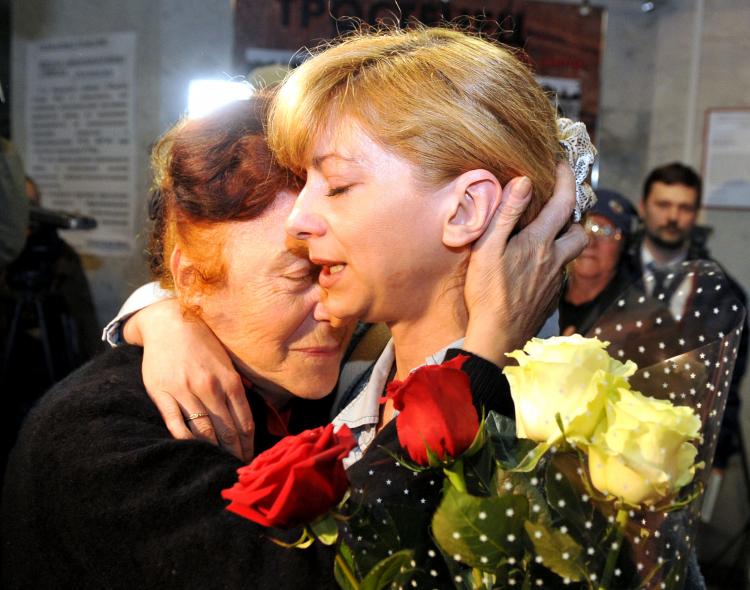 Belarus opposition leader Andrei Sannikov 's wife, Irina Khalip (R), embraces her mother-in-law Alla Sannikov (L), after Khalips release at the court in Minsk on May 16. (Viktor Drachev/Getty Images)