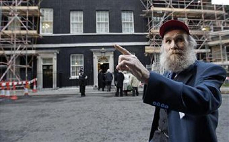 Buster Martin, one of Britain's oldest workers who claims he is 102 years old, arrives at 10 Downing Street in London, on October 01, 2008, as he prepares to discuss the rights of older workers and the issue of retirement.SHAUN CURRY/AFP/Getty Images