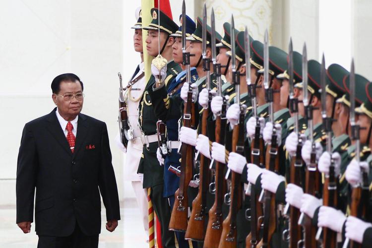 STRONG BACKING: Burmese military junta leader Gen. Than Shwe reviews a Chinese honor guard during a welcoming ceremony in Beijing, China, last September. Than Shwe retired as head of the Burmese military earlier this month, but many believe he still maintains a grip on power inside the isolated country. (Feng Li/Getty Images)