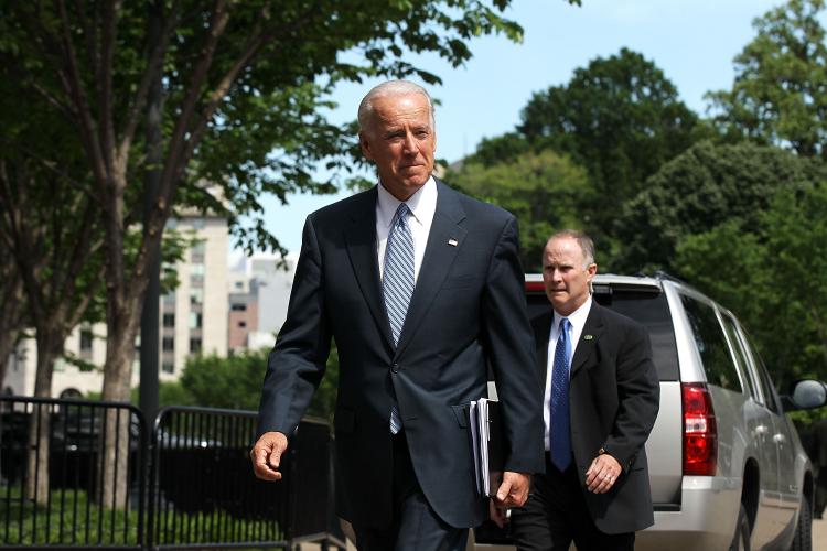 BUDGET TALKS: Vice President Joseph Biden walks from the White House to Blair House for a meeting with congressional members Tuesday in Washington. Biden met with a bipartisan, bicameral group of members of Congress to continue work on legislation for deficit reduction. (Alex Wong/Getty Images)