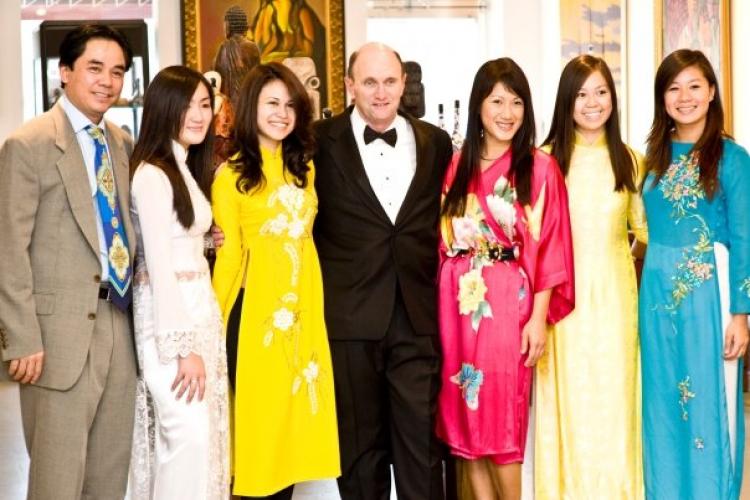 LAC VIET GALLERY: Bill Ridley (middle), Tu-Anh Nguyen (in pink), the gallery owner Duc Nguyen (left), and models from Polished by Tu-Anh Taken at Lac Viet Gallery in Arlington, VA on Oct. 3. (Frank Nguyen)
