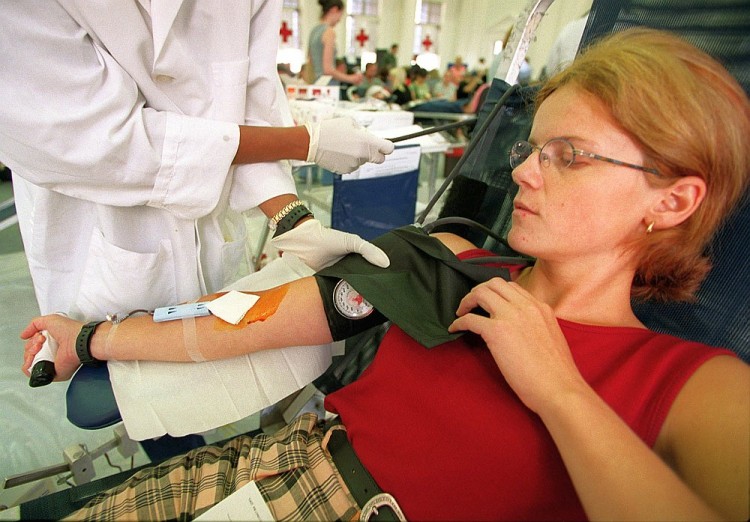 A woman gives blood at the American Red Cross in Washington, D.C. in this file photo. (Manny Ceneta/AFP)