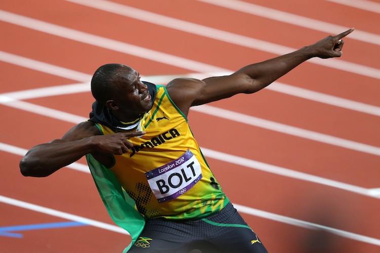 Usain Bolt captures the gold medal in the men's 100m at the London Olympics on Sunday. (Cameron Spencer/Getty Images)