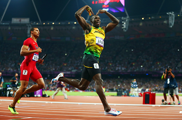 Usain Bolt of Jamaica celebrates as he crosses the finish line to win gold and set a new world record in the Men's 4 x 100m Relay Final on Day 15 of the London 2012 Olympic Games. (Michael Steele/Getty Images)