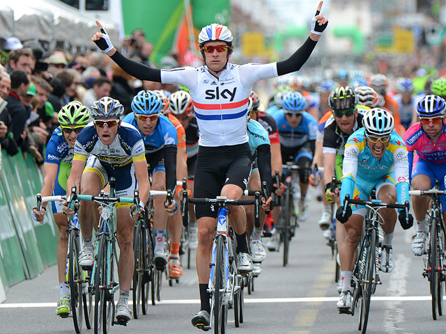 Sky's Bradley Wiggins (C) wins the Stage One sprint to claim the leader's jersey. (teamsky.com)