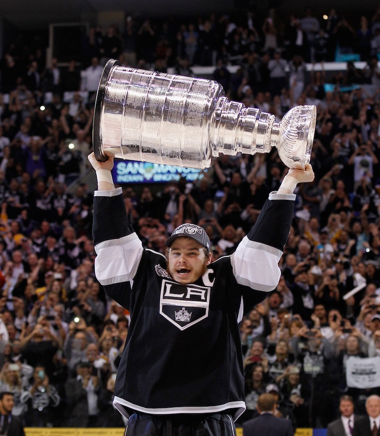 Los Angeles Kings captain Dustin Brown hoists the Stanley Cup. (Bruce Bennett/Getty Images)