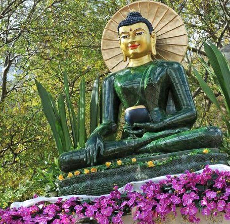 The Jade Buddha for Universal Peace, displayed here in Sydney in 2009, is the largest Buddha figure carved from gemstone quality nephrite jade. The statue was carved from a rare18-ton boulder discovered at the Polar Jade mine in northwestern British Columbia. (GREG WOOD/AFP/Getty Images)